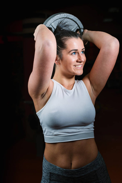 Athletic woman training in gym  - Fotó, kép