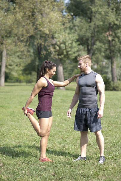 Young couple training in park - Photo, Image
