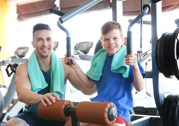 Dad and son in gym - Photo, image