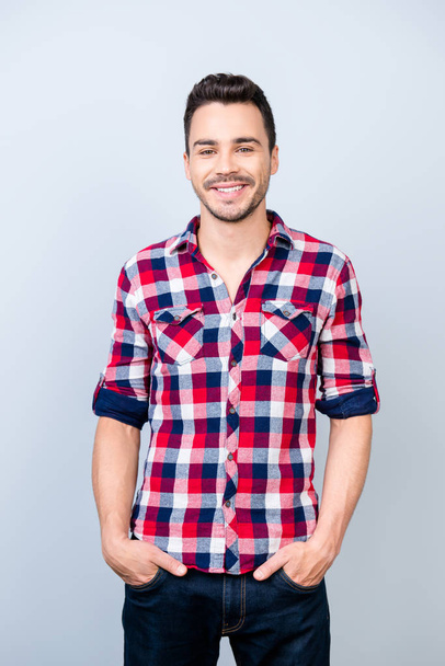 Success concept. Smiling young stylish bearded brunet student in - 写真・画像
