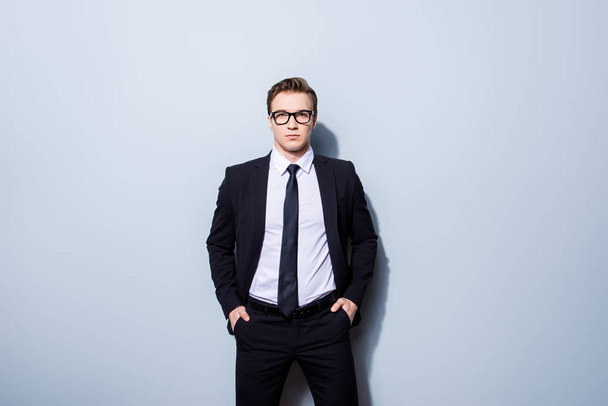 Success concept. Stylish young lawyer man, standing on pure back - Foto, Bild