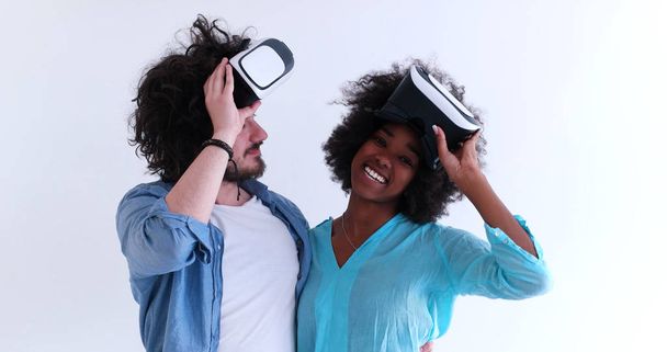 multiethnic couple getting experience using VR headset glasses - Photo, Image