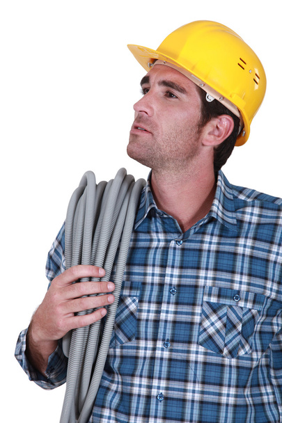 Ein Bauarbeiter blickt nach oben - Foto, Bild