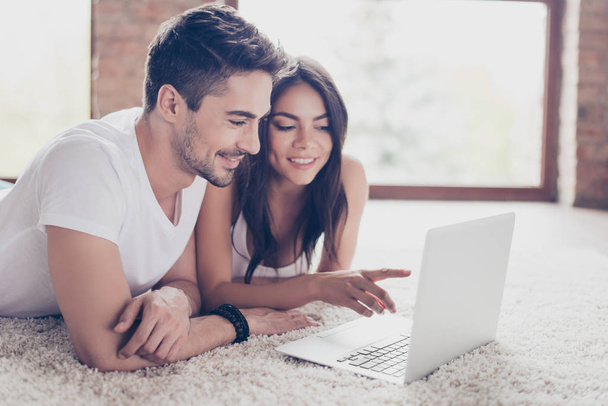 Beautiful latino mulatto lovers are browsing info on laptop and  - Fotoğraf, Görsel