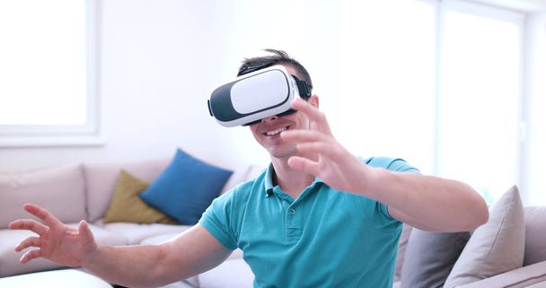 man using VR-headset glasses of virtual reality - Фото, изображение