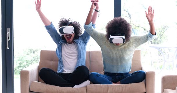 Multiethnic Couple using virtual reality headset - Foto, imagen