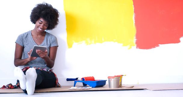black female painter sitting on floor - Photo, Image