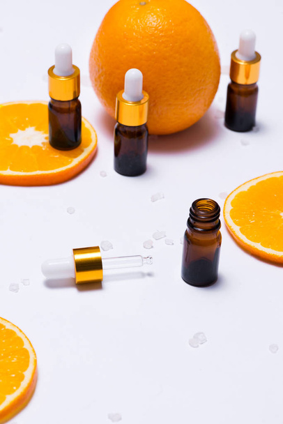 cosmetic containers with orange slices - Photo, Image