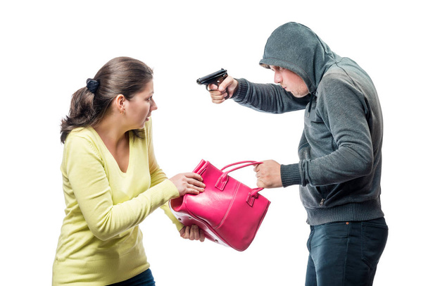 Ladrão ameaça uma vítima com uma arma, rouba um saco
 - Foto, Imagem