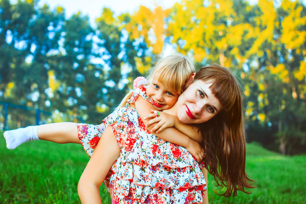 Girl with mom in nature - Photo, Image