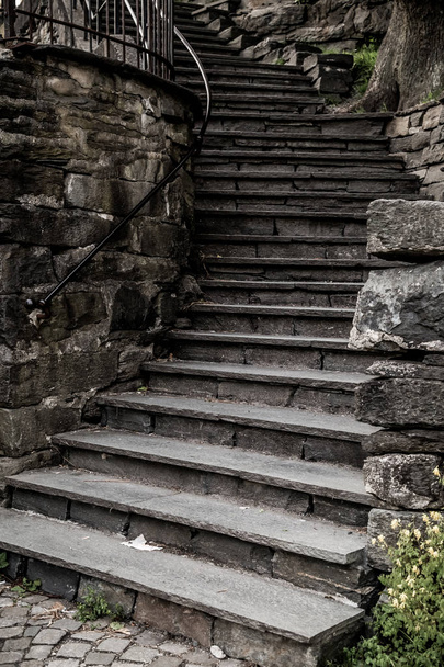 Grungy stone stairs leading a way down - Photo, image
