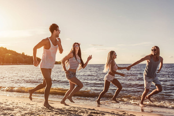 Group of friends on beach - Фото, изображение