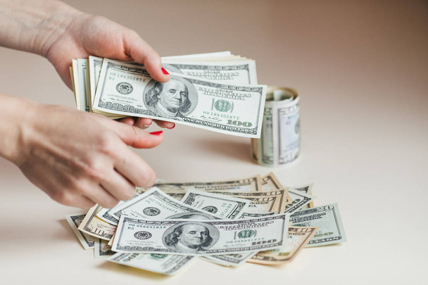 Hands holding money dollars - Foto, afbeelding