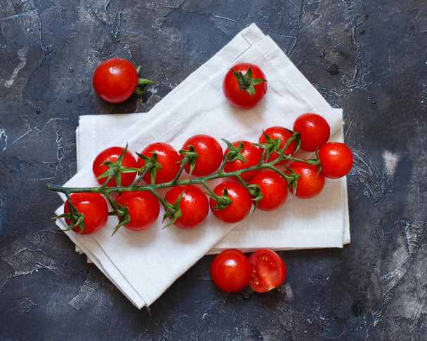 Cherry tomatoes on a dark background - Photo, Image