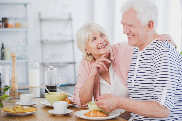 Senior man and woman at breakfast - Foto, imagen