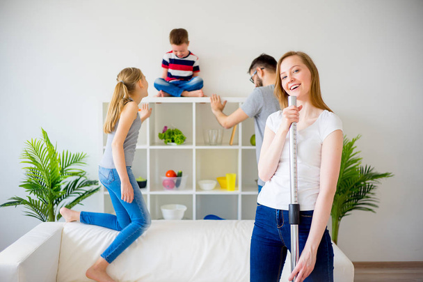 Housewife vaccuum cleaning - Fotoğraf, Görsel