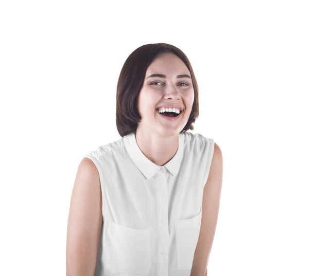 A happily smiling student. An attractive girl isolated on a white background. A confident brunette female in a casual blouse.  - Фото, зображення