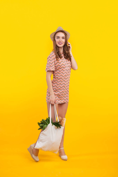 Girl with bag of grocery - Фото, зображення