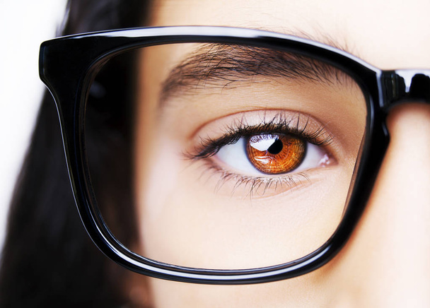 Image of a beautiful young girl wearing glasses. Close up shot - Zdjęcie, obraz