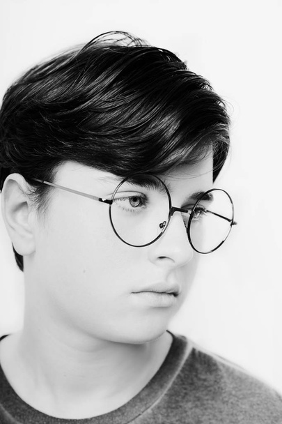 Portrait of a boy wearing eyeglasses eyes close, macro studio shot - Foto, Bild
