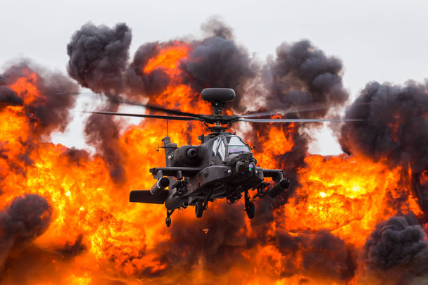 Army Air Corps WAH-64D Apache in front of a wall of fire - Foto, Imagen