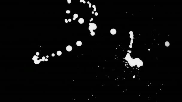 White Ink Splatter Over Black Screen Background - Footage, Video