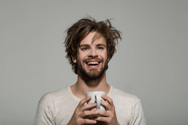 smiling man with cup of tea or coffee - Foto, immagini