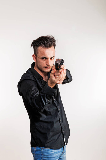 Boy with gun in his hand - Foto, Bild