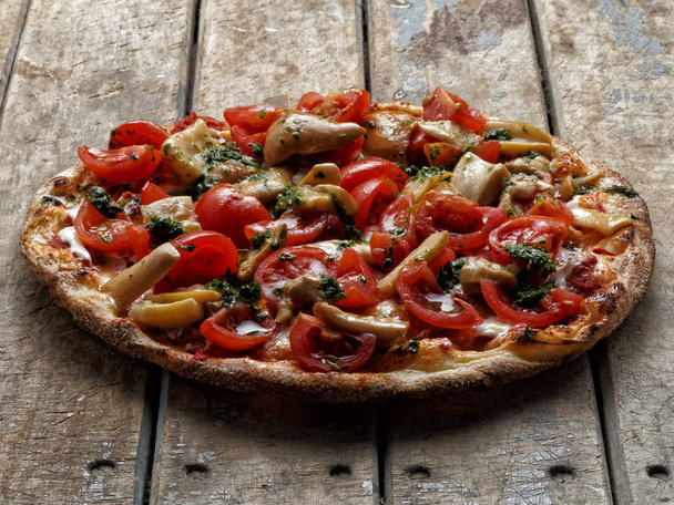Pizza mushrooms tomatoes angle view - Photo, Image