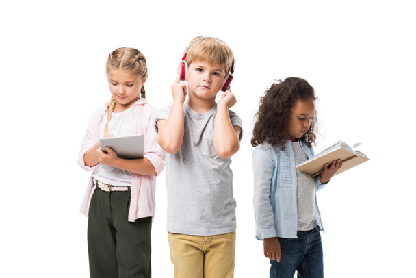 children with gadgets and book - Photo, Image