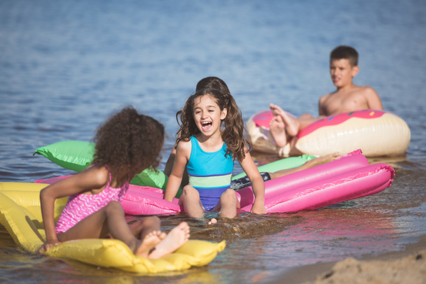 kids have fun on inflatable mattresses - Photo, Image