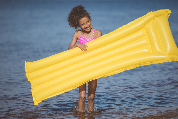 african american girl with inflatable mattress - Fotografie, Obrázek