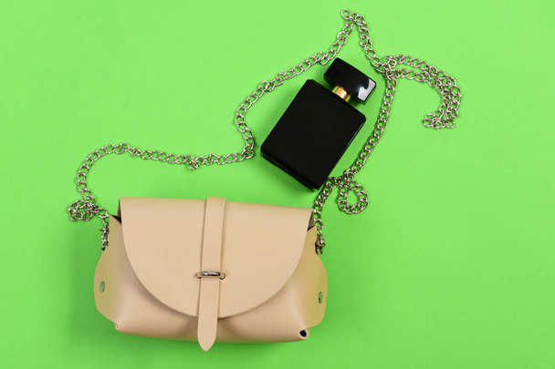Purse in light beige color with chain and perfume. Accessories - Foto, Imagem