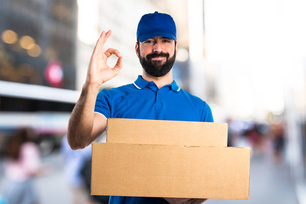 Delivery man making OK sign - Photo, Image