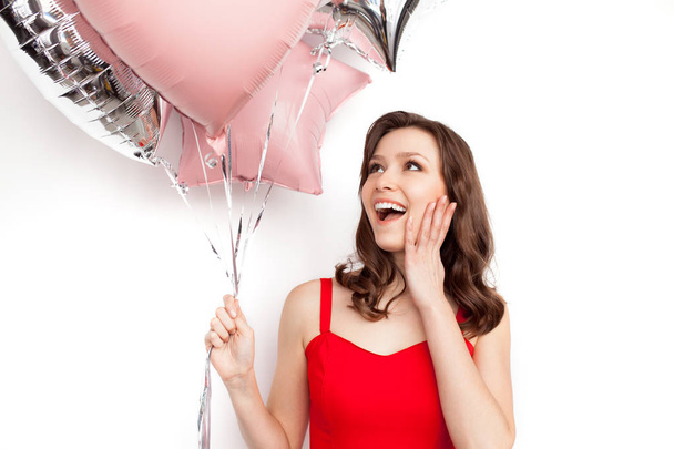 Surprised girl with balloons - 写真・画像