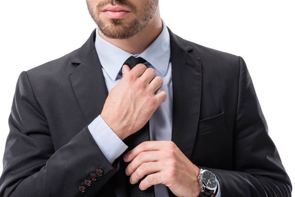 businessman tying necktie - Foto, afbeelding