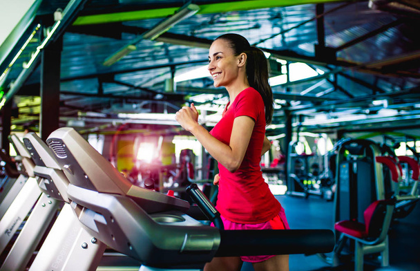 Woman exercising on treadmill  - Foto, imagen