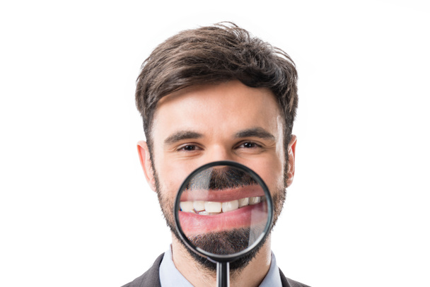 businessman with magnifying glass - Foto, afbeelding