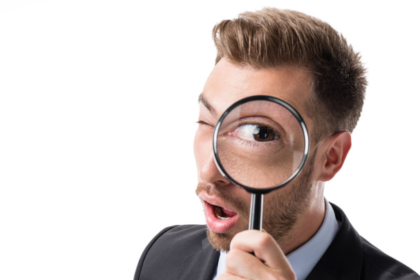 businessman with magnifying glass - Foto, immagini