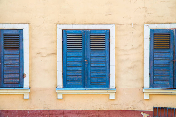 Windows with old blue shutters - 写真・画像