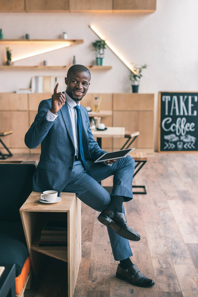 businessman using digital tablet in cafe  - Fotó, kép