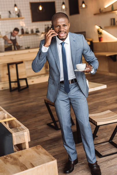 african american businessman with smartphone - Fotó, kép