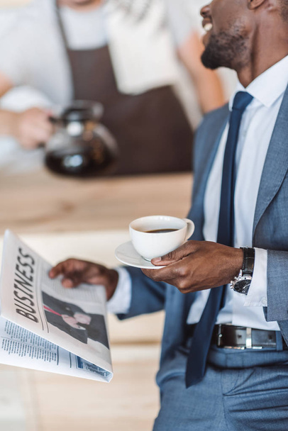 businessman with coffee reading newspaper - Photo, Image