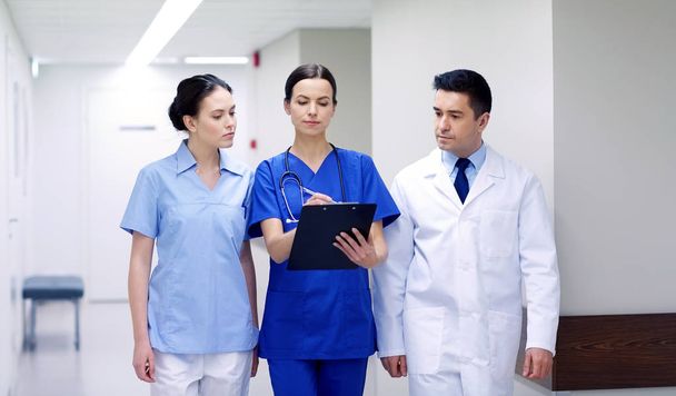 group of medics at hospital with clipboard - Фото, зображення