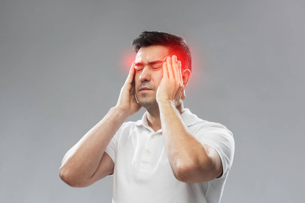 unhappy man suffering from head ache - Foto, immagini