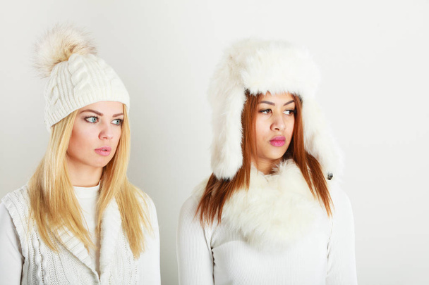 Two ladies in winter white outfit. - Foto, Imagen