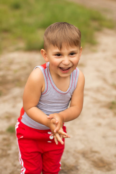 A cute boy in a summer park - Fotografie, Obrázek