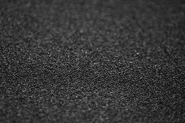 textuur van zwarte spons uit als achtergrond - Foto, afbeelding