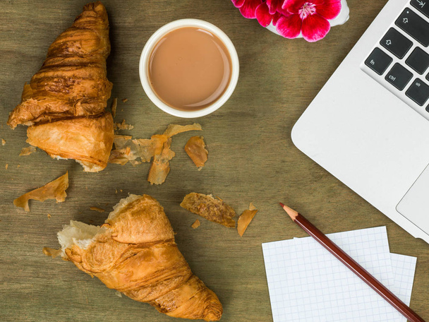 Croissant and a Cup of Tea Working Breakfast or Snack  - Photo, Image