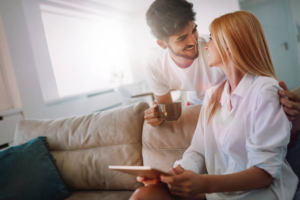 Young attractive couple spending time together at home - Photo, image
